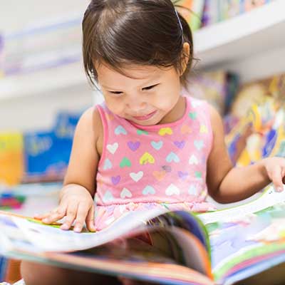Nevada Early Childhood Advisory Council Home Page Hot Topics 01 Young girl reading a picture book