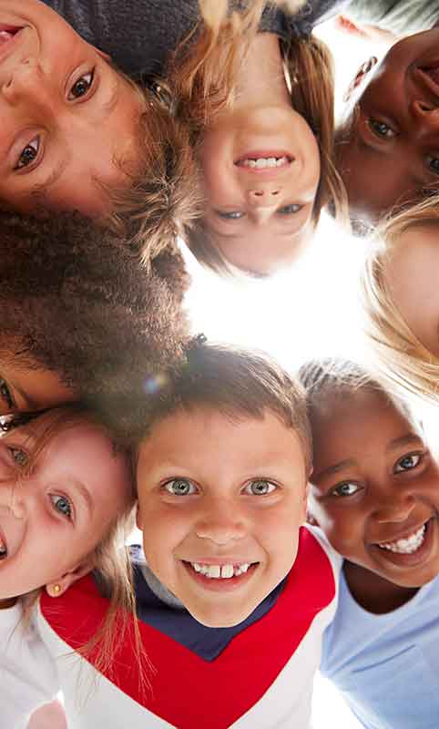 Nevada ECAC Hot Topics Resources Children looking up and smiling at the camera