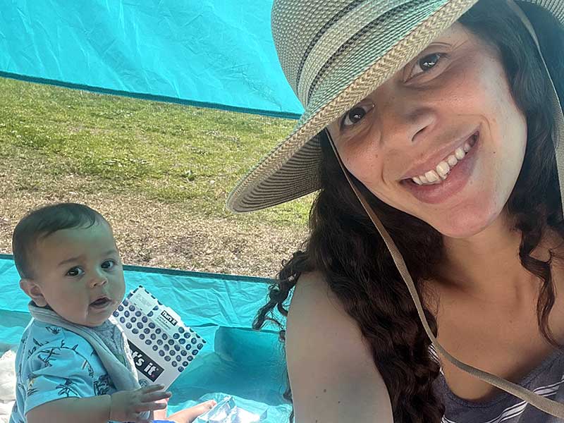 Nevada ECAC About Us Our Goals Mother and baby seated on a picnic blanket