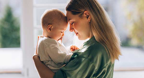 Family member playing with a young child