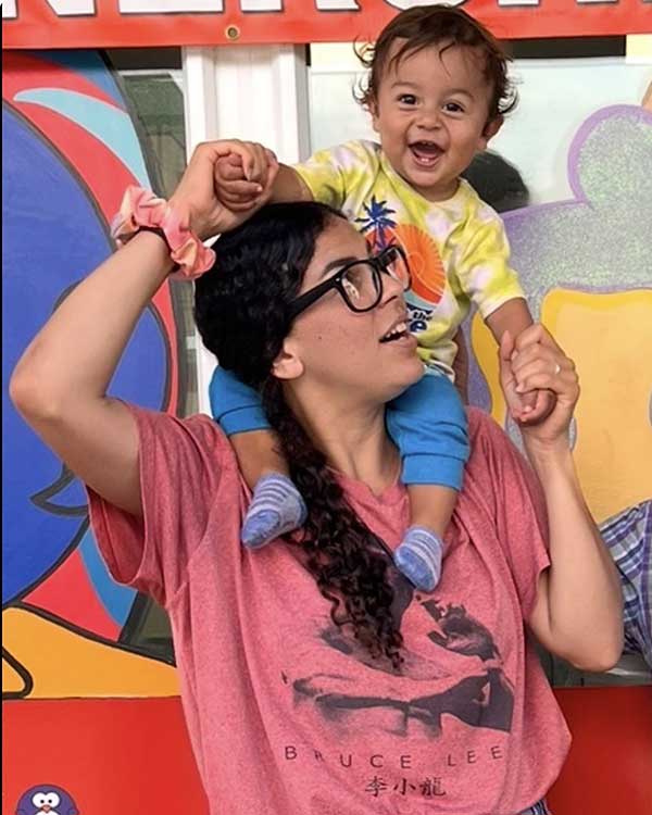 Smiling parent holding a child