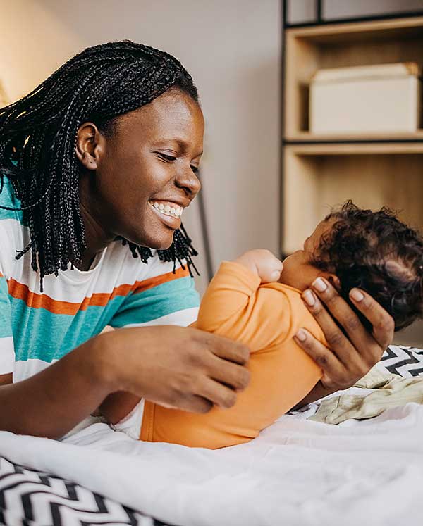Mother kissing a young child