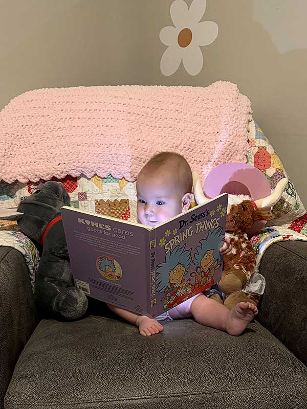 Nevada ECAC General Meetings Documents and Materials Baby looking at a picture book