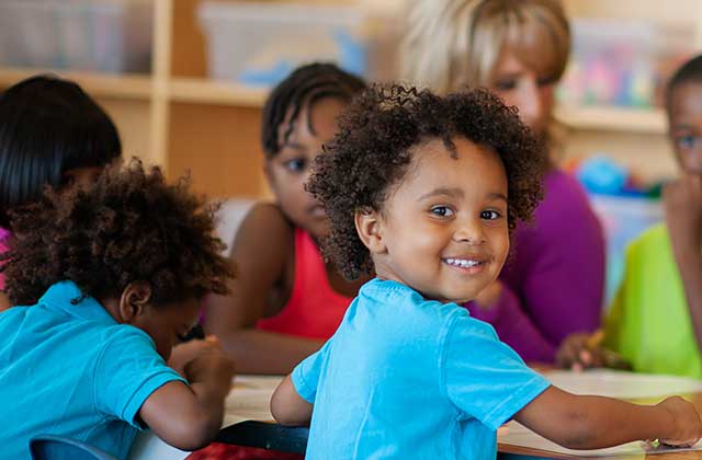 Nevada ECAC Subcommittees Have Questions Adult helping a child draw or color